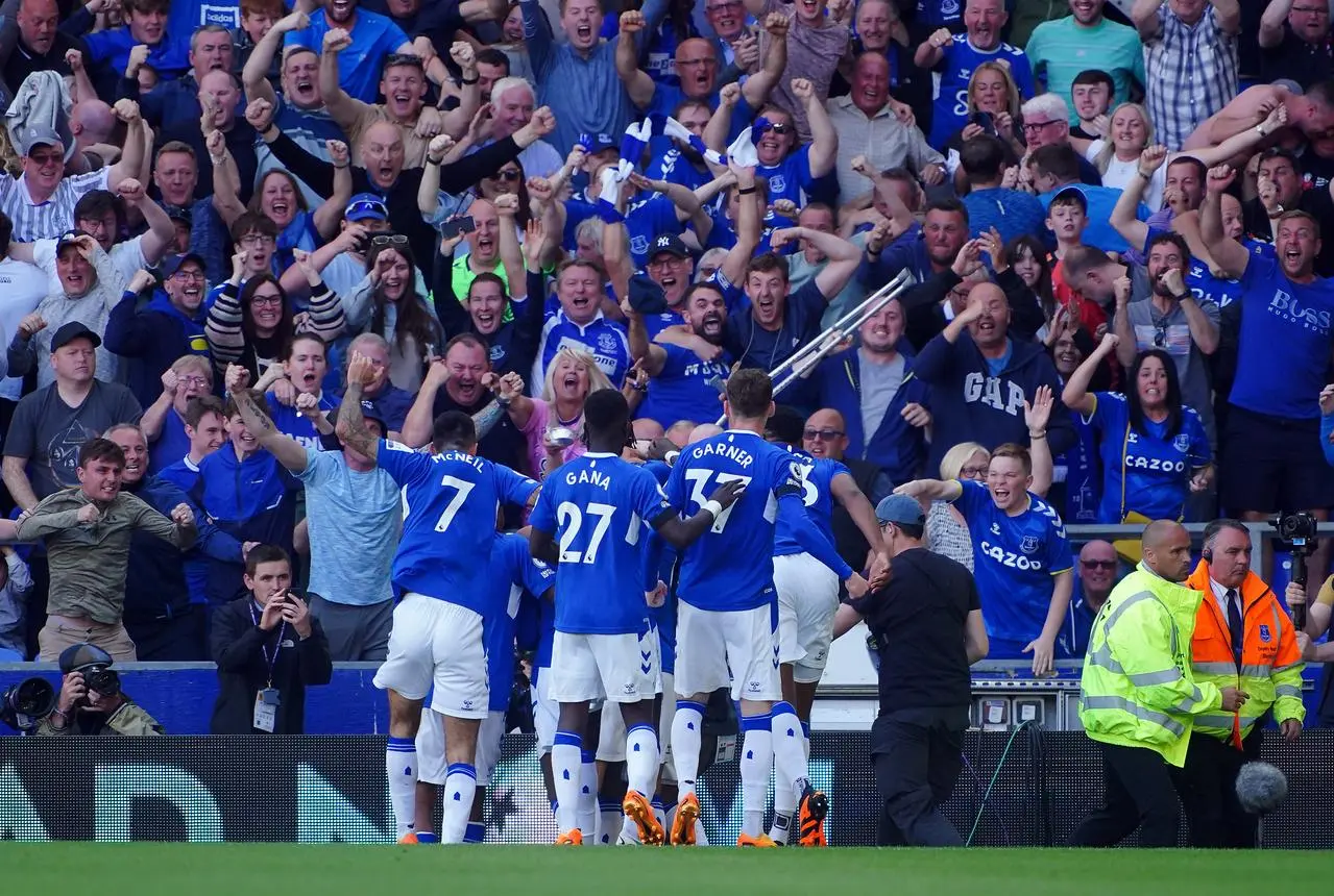 Everton players celebrate Abdoulaye Doucoure's winner against Bournemouth last month that secured their top flight status 