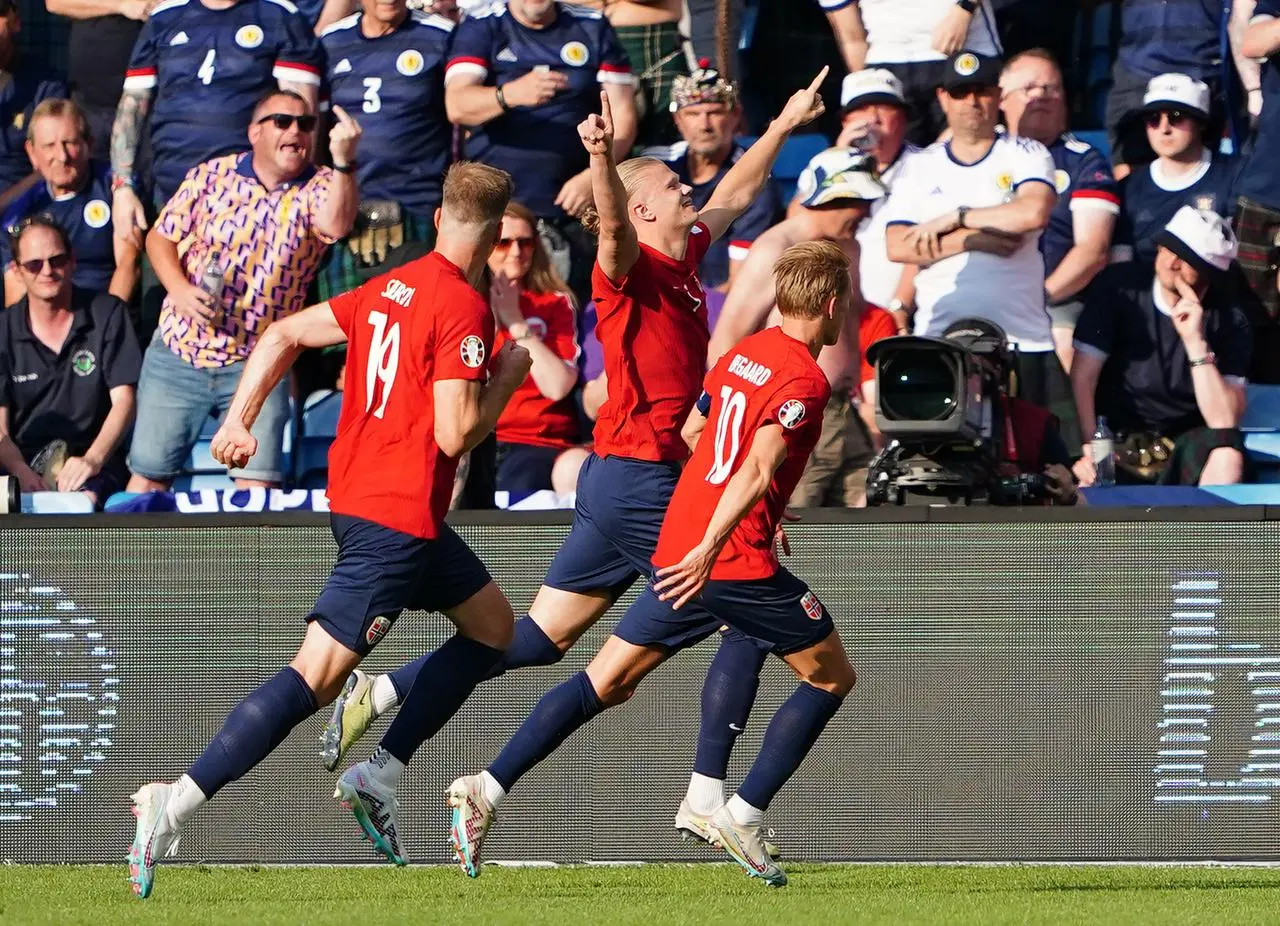 Erling Haaland celebrates scoring 