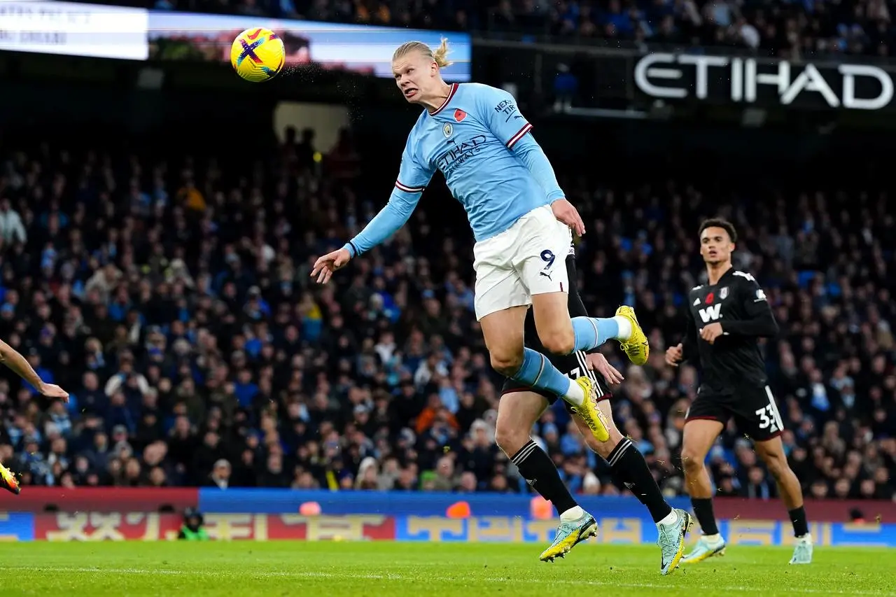 Manchester City's Erling Haaland scores a header