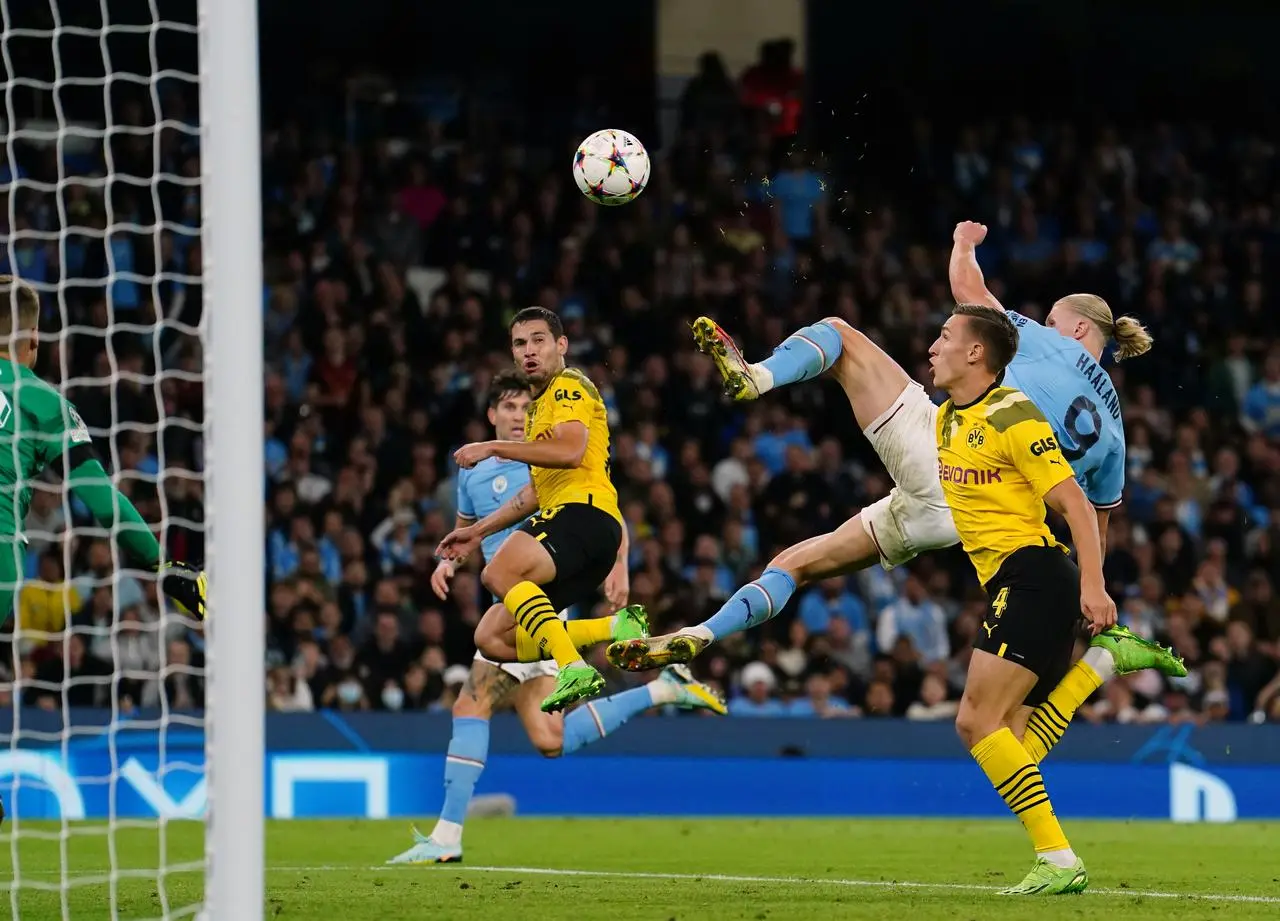 Erling Haaland (right) scores