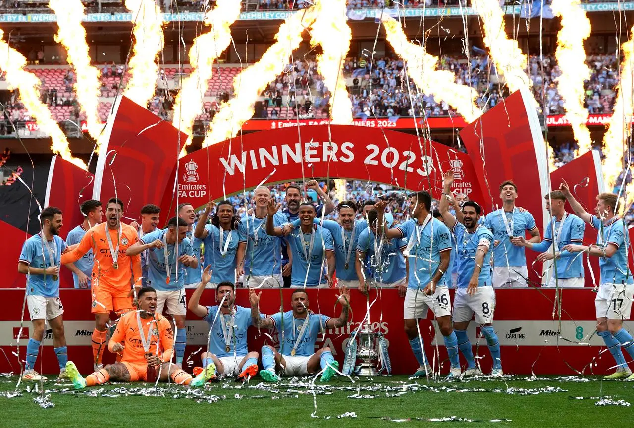 Manchester City celebrate winning the FA Cup