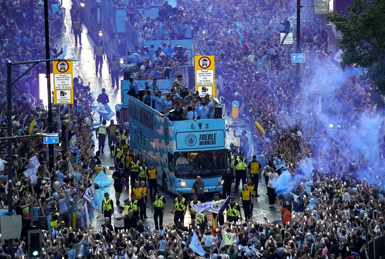 A general view of the Manchester City team buses during the treble parade