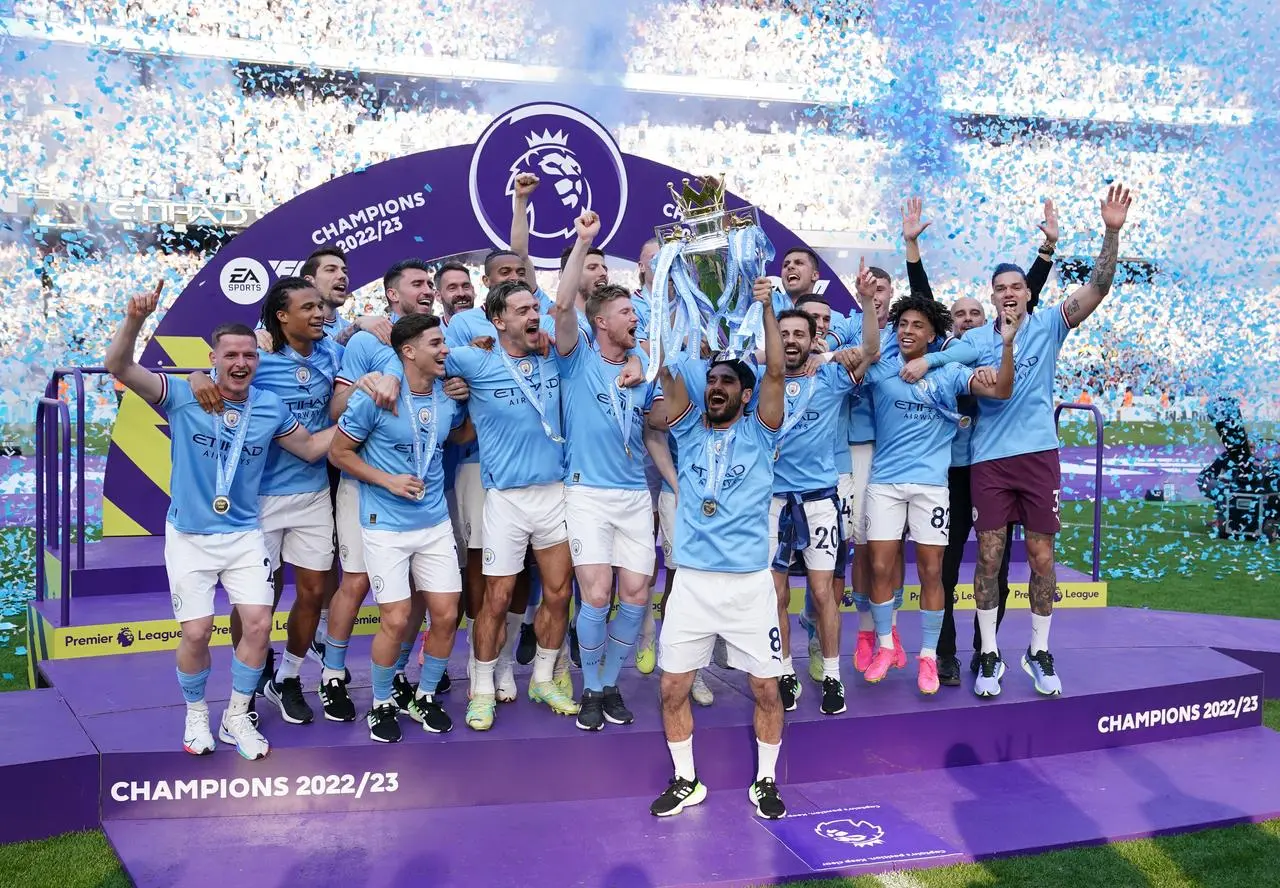 Manchester City with the Premier League trophy