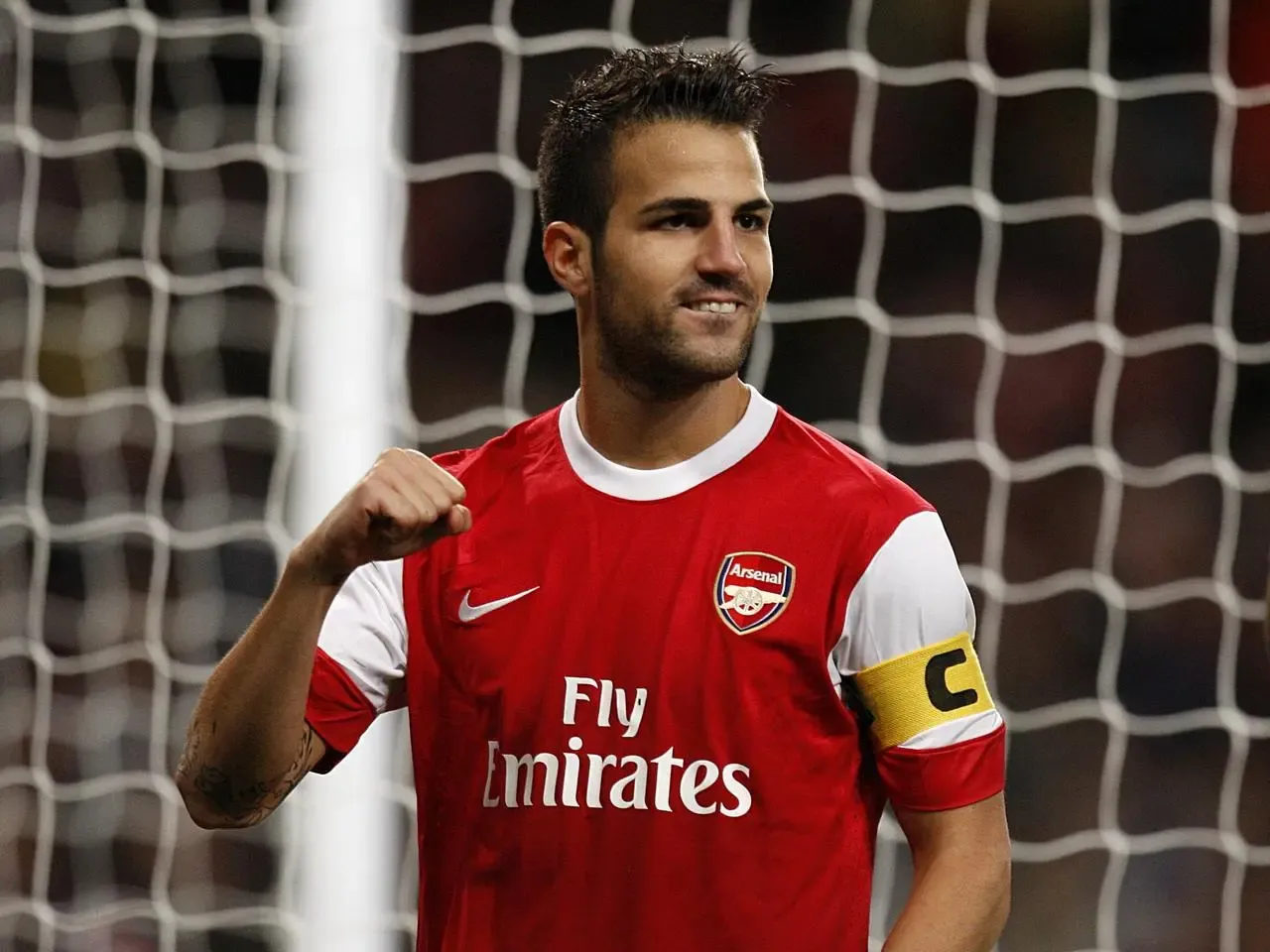 Cesc Fabregas celebrates scoring for Arsenal against Braga in the Champions League