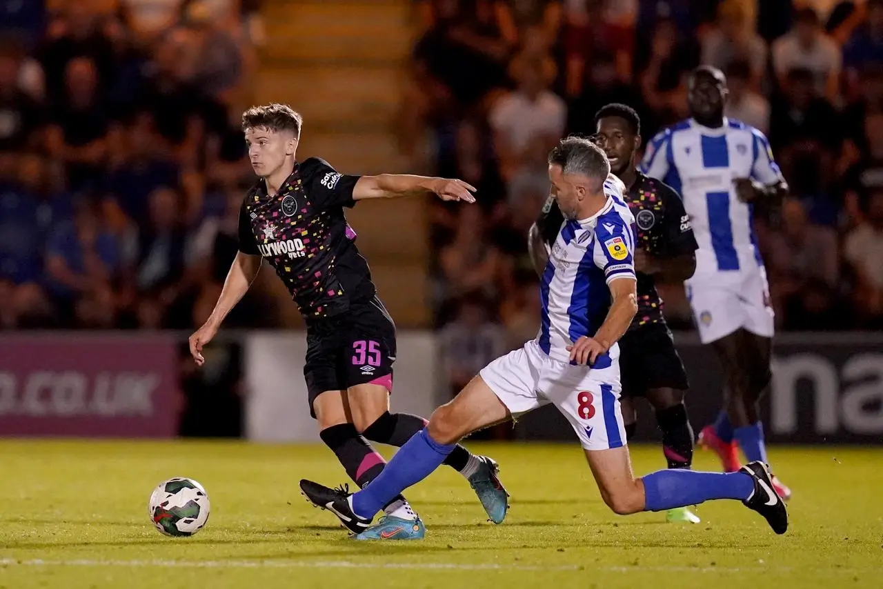 Brentford's Ryan Trevitt, left, in Carabao Cup action against Colchester