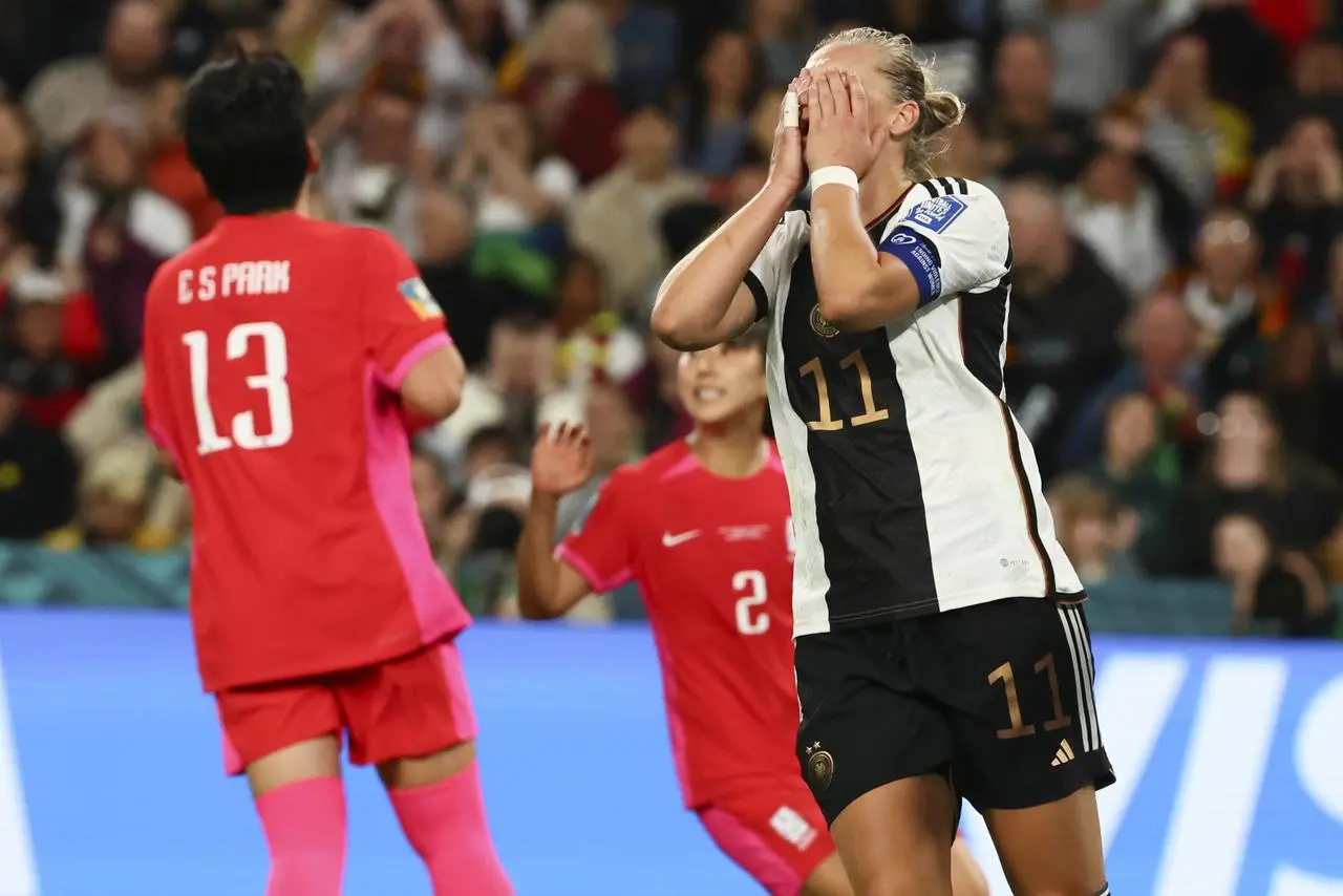 Germany’s Alexandra Popp, right, reacts after South Korea’s goalkeeper Kim Jung-mi saved her shot at goal