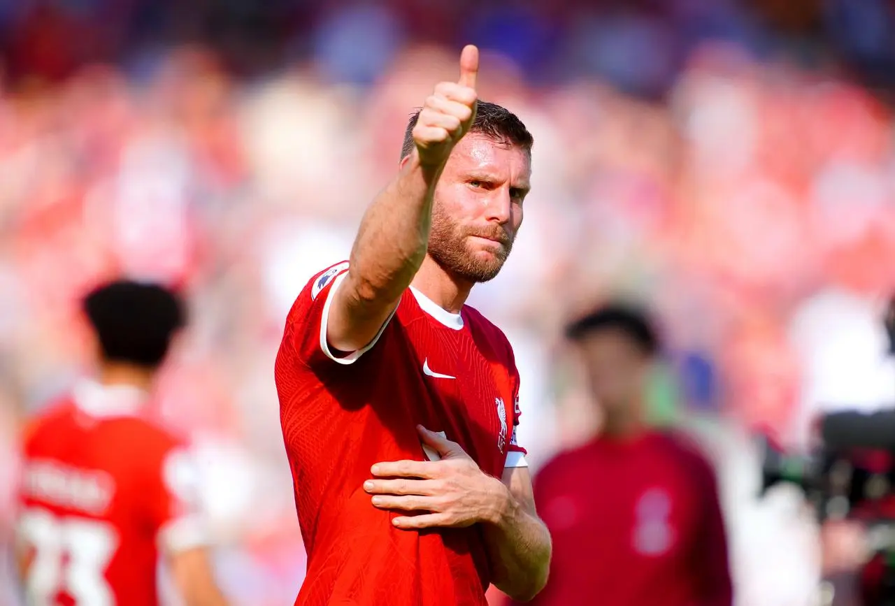 James Milner gives a thumbs-up to the Liverpool fans on his final appearance at Anfield