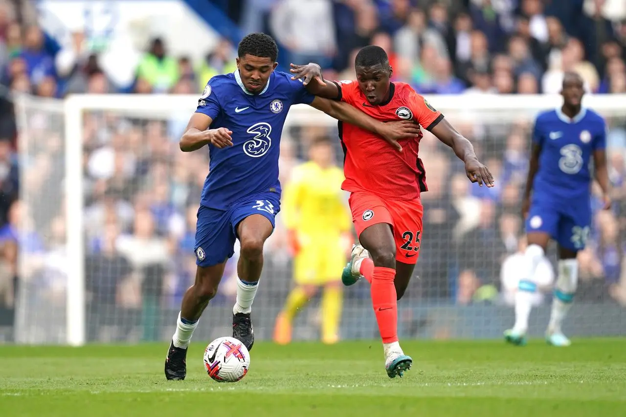 Moises Caicedo, right, challenges Chelsea’s Wesley Fofana for possession