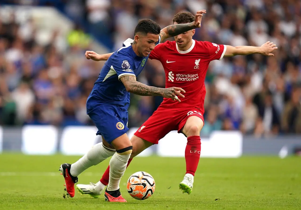 Chelsea's Enzo Fernandez, left, shields the ball from Liverpool's Diogo Jota