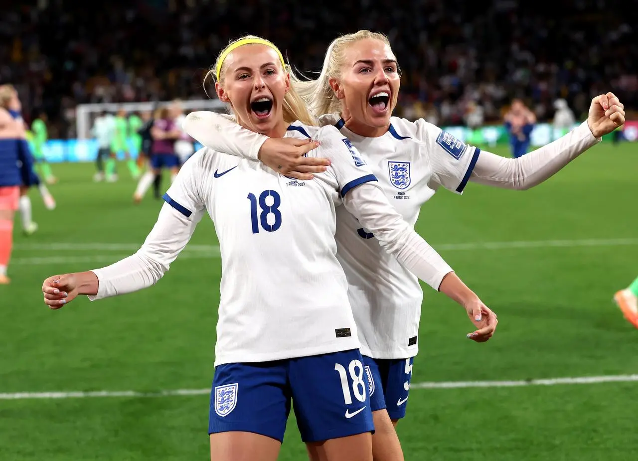 Chloe Kelly and Alex Greenwood celebrate victory