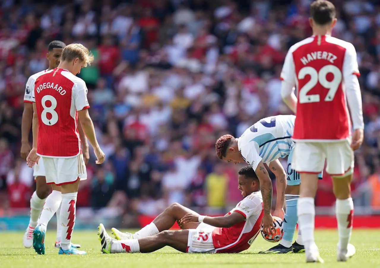 Timber (centre) was forced off early on in the second-half against Nottingham Forest