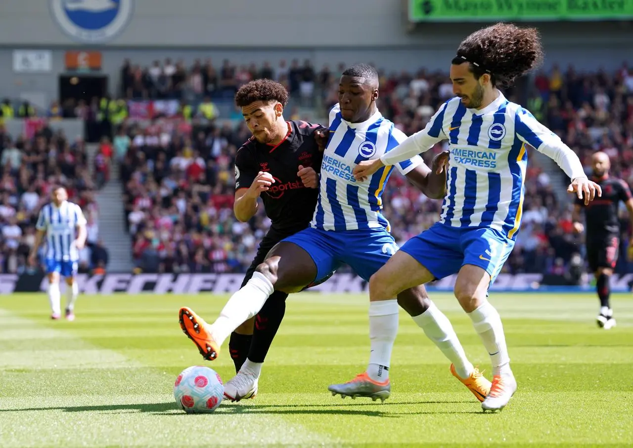 Brighton's Moises Caicedo, centre, and Marc Cucurella, right, challenge Southampton's Che Adams in April 2022