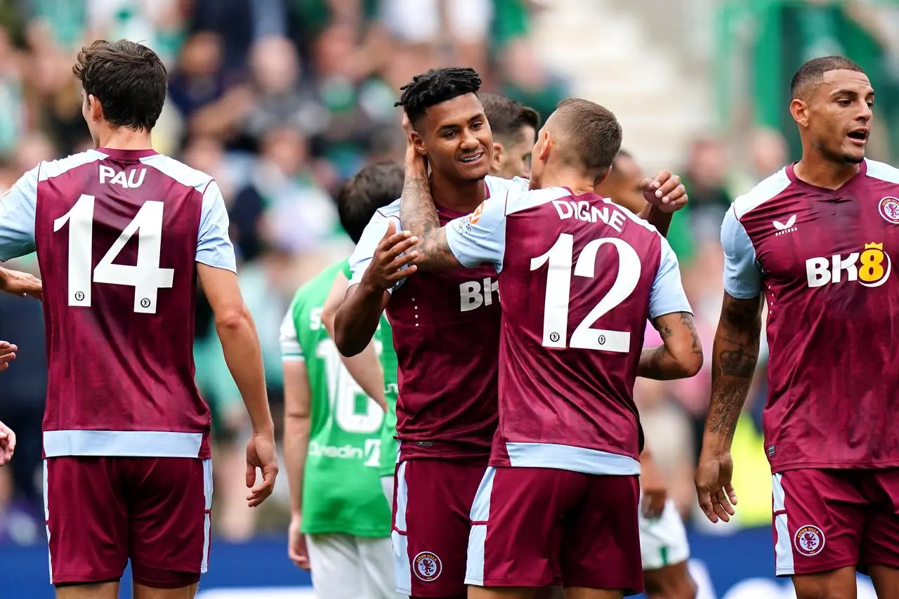 Ollie Watkins celebrates with Lucas Digne