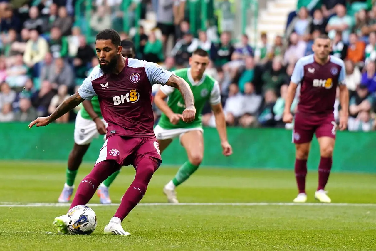 Douglas Luiz slots home from the penalty spot 