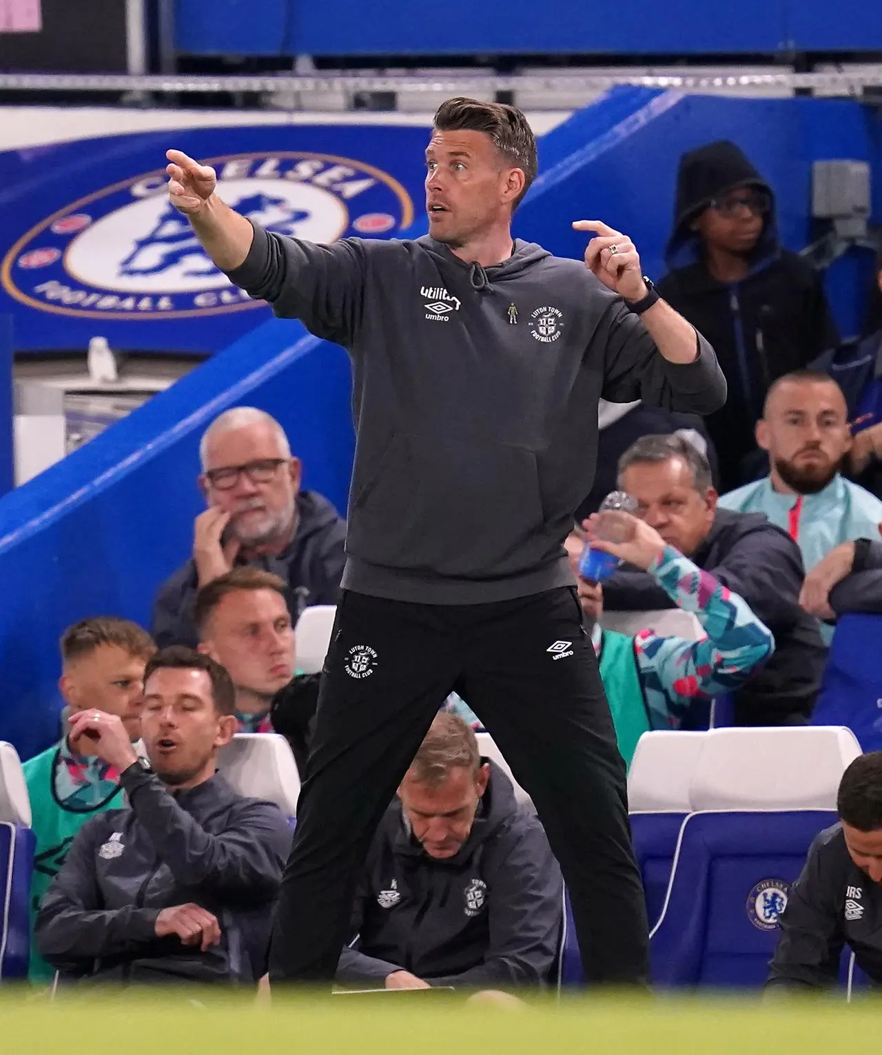 Rob Edwards gives instructions to his Luton team at Stamford Bridge