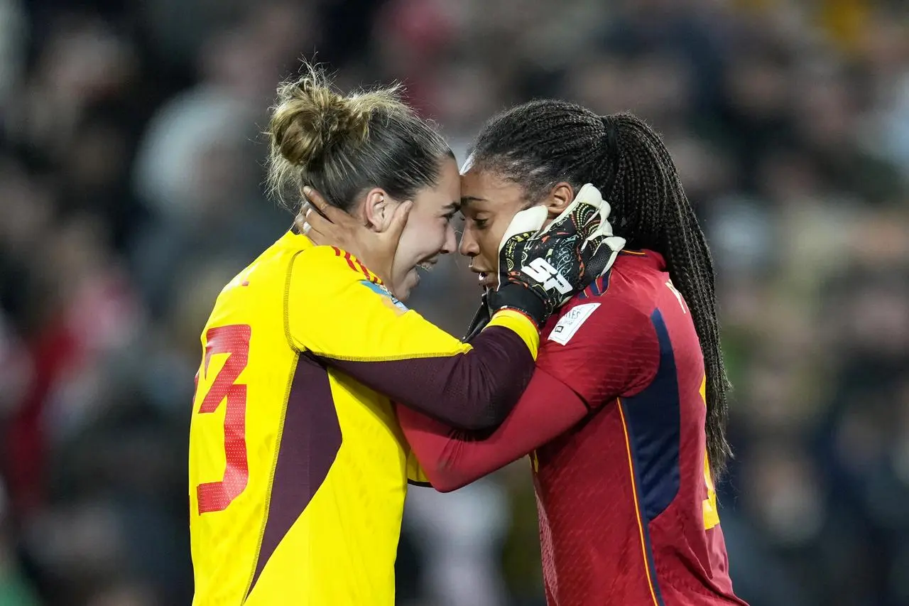 Cata Coll, left, and Salma Paralluelo celebrate Spain's World Cup win