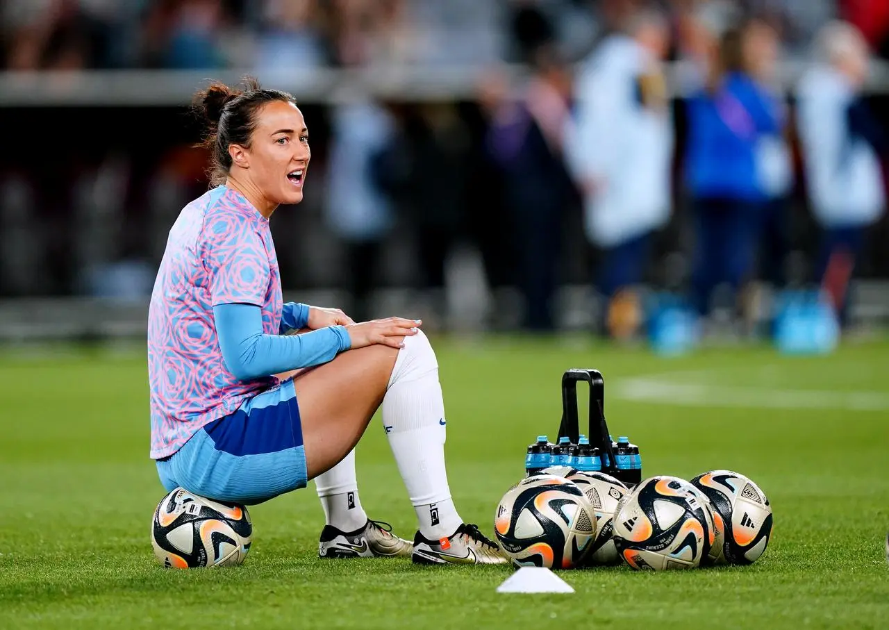 Lucy Bronze sits on a ball during the warm-up in Sydney