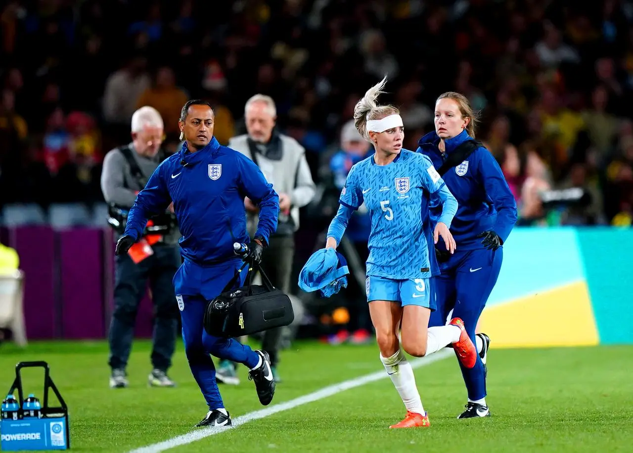 Alex Greenwood needed a bandage wrapped around her head following a stray knee by Salma Paralluelo