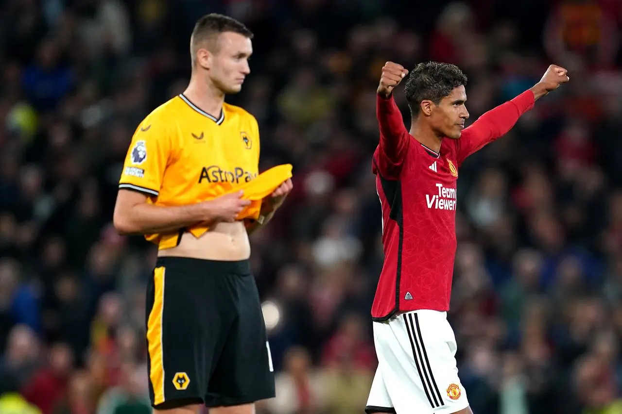 Raphael Varane (right) celebrates victory