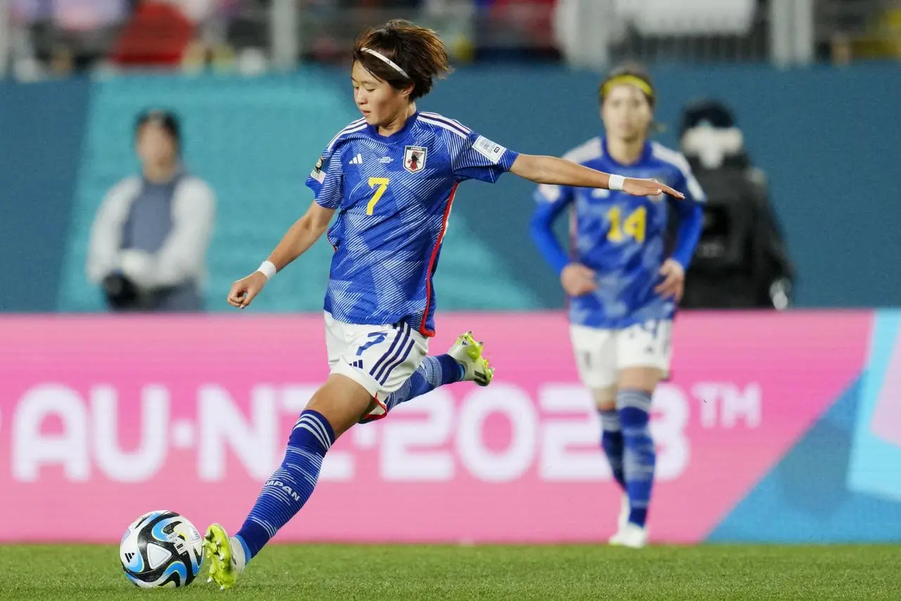 Hinata Miyazawa strikes the ball in Japan's defeat to Sweden