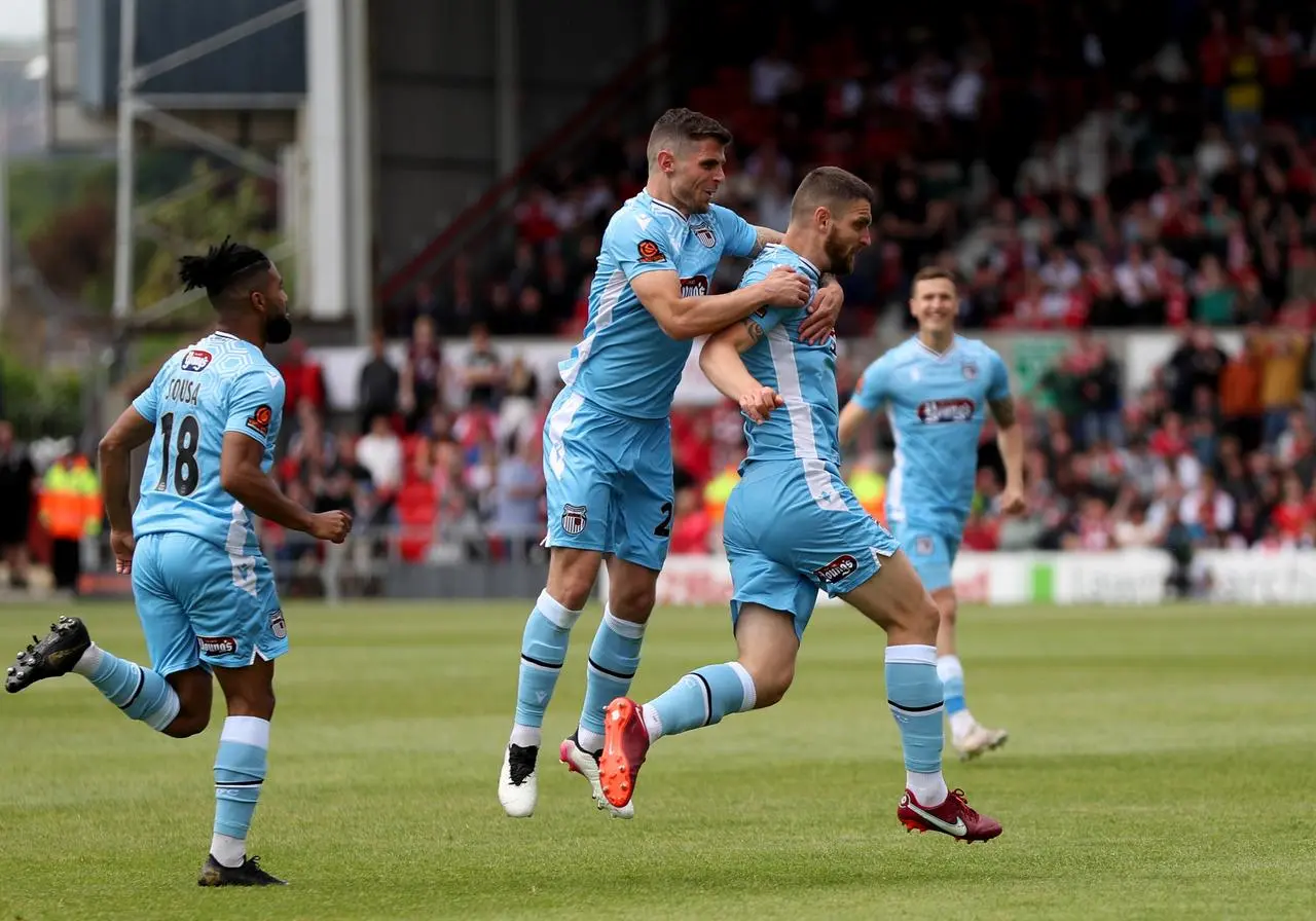 Luke Waterfall, right, celebrates his play-off winner against Wrexham