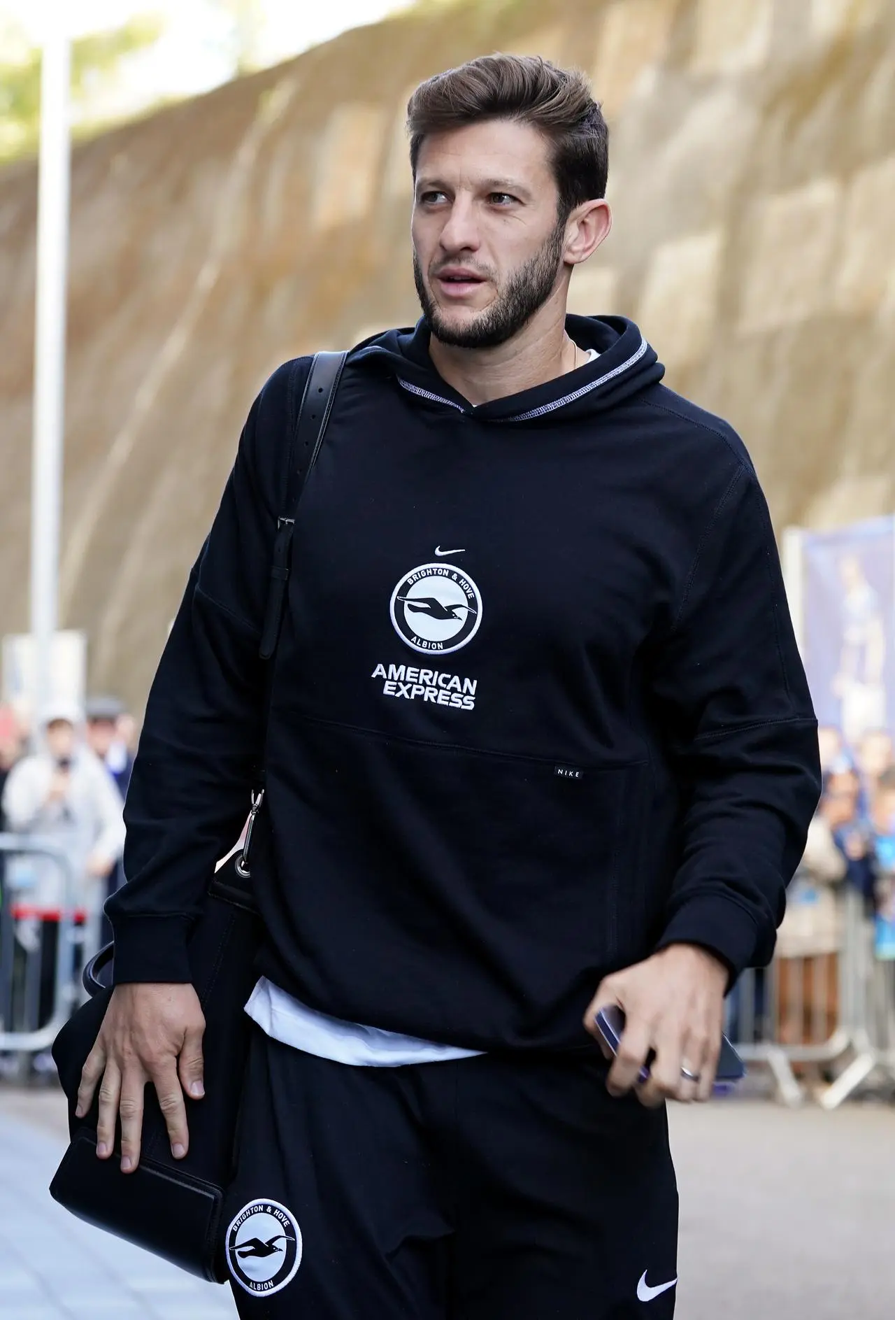 Adam Lallana arrives at Brighton