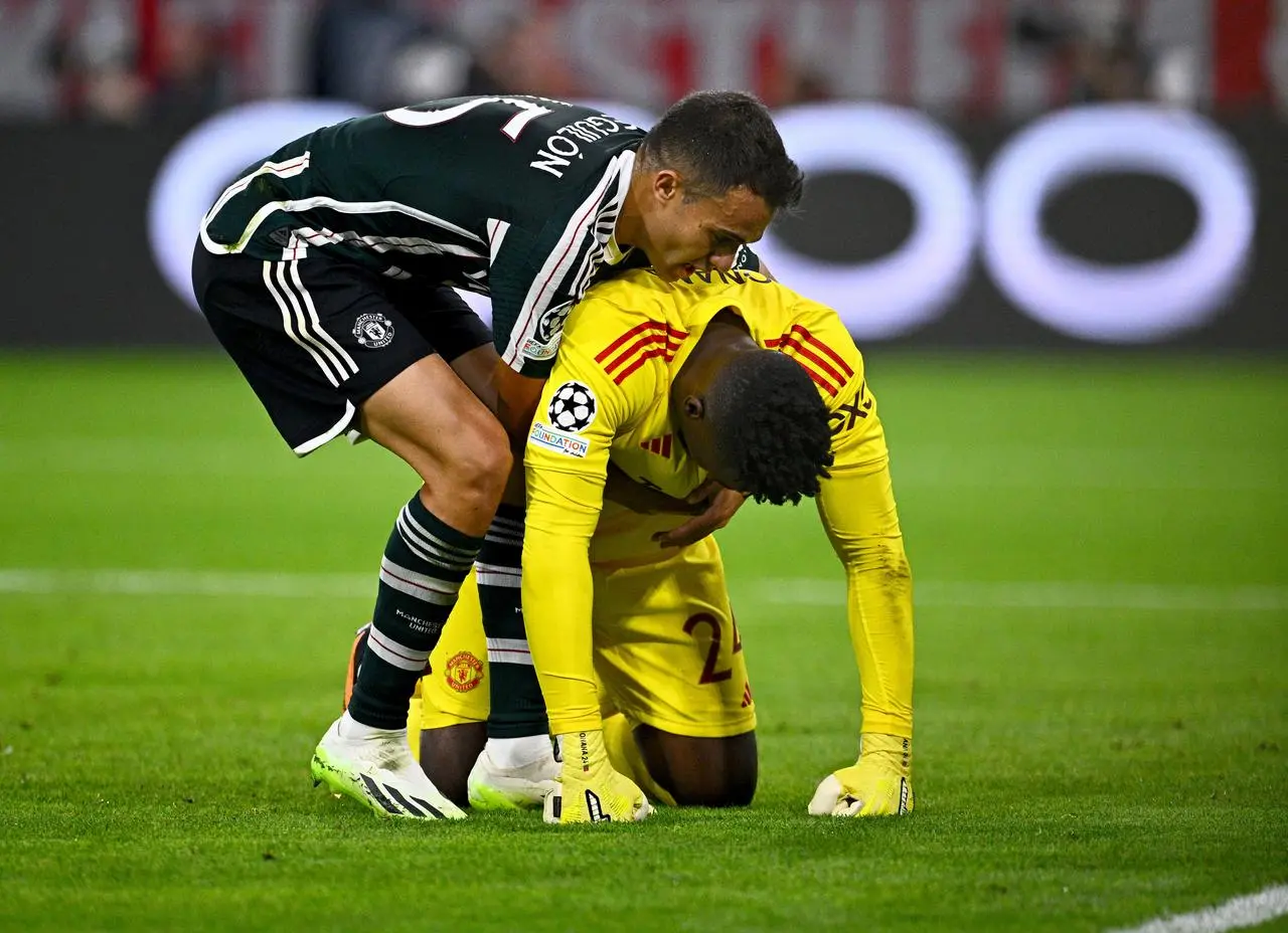 Andre Onana is consoled after conceding