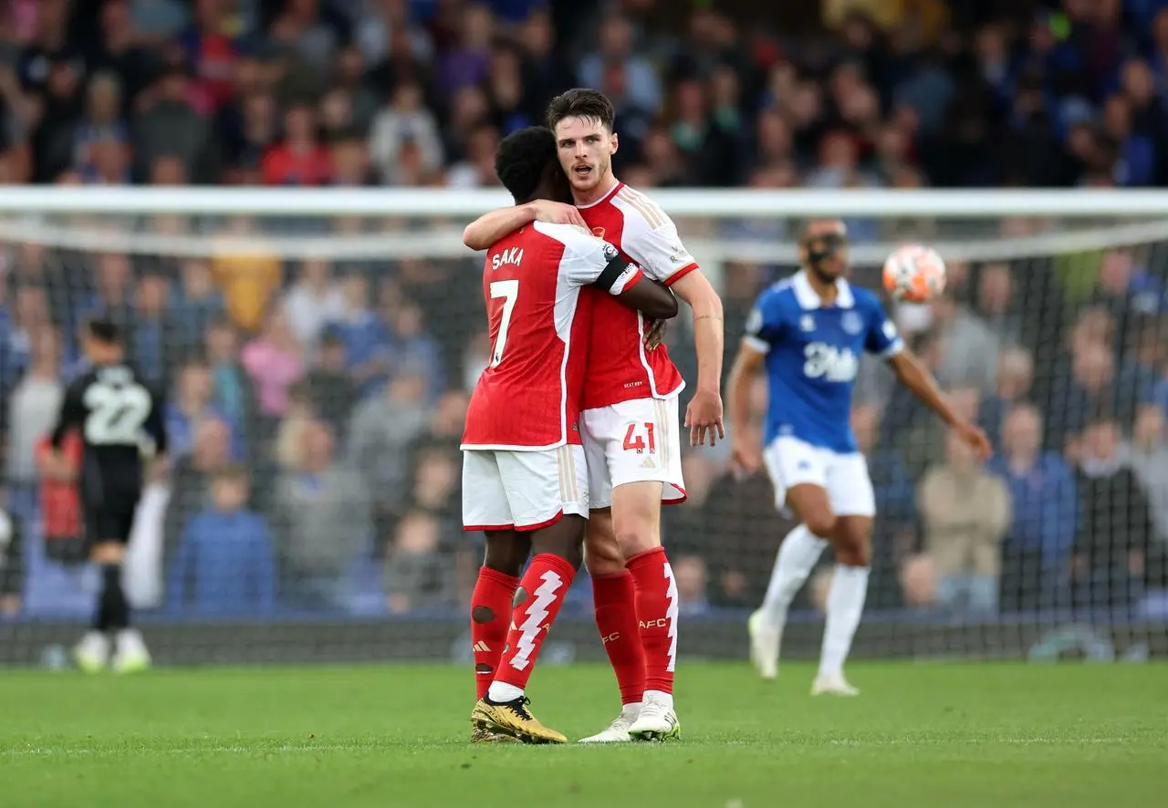 Bukayo Saka, left, and Declan Rice celebrate victory over Everton