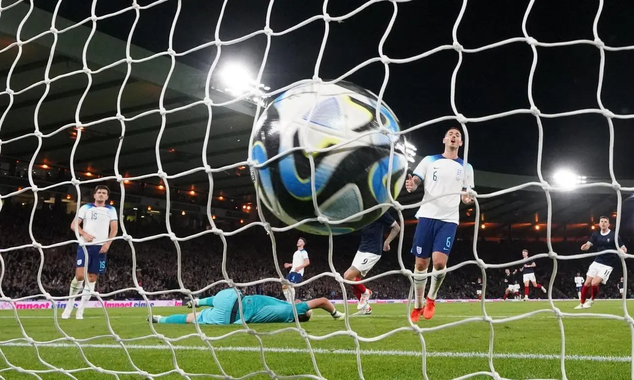 Maguire (left) netted an own goal at Hampden