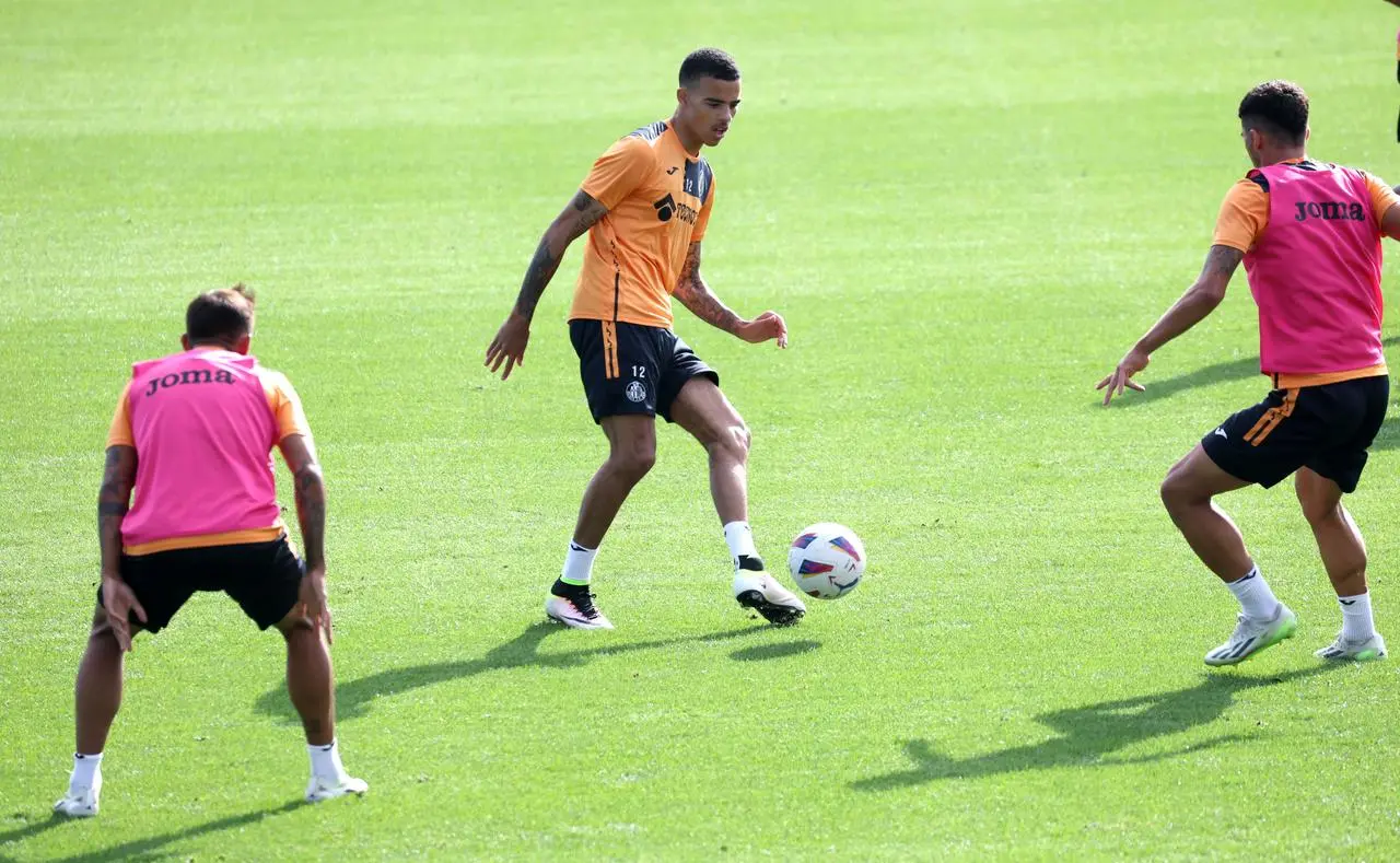 Mason Greenwood, centre, training with his new team-mates on Tuesday