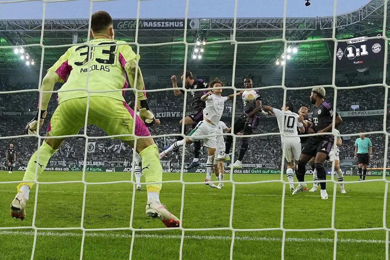 Mathys Tel (centre) heads Bayern Munich to victory at Borussia Monchengladbach