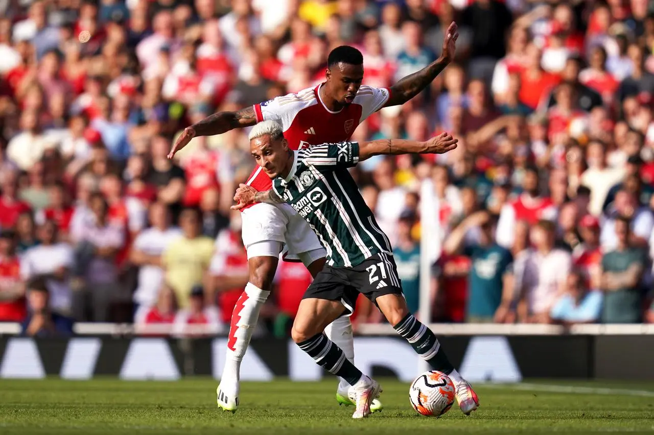 Antony (right) in action for Manchester United