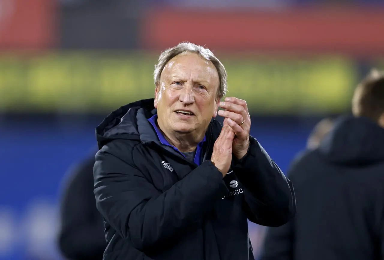 Huddersfield manager Neil Warnock applauds the fans