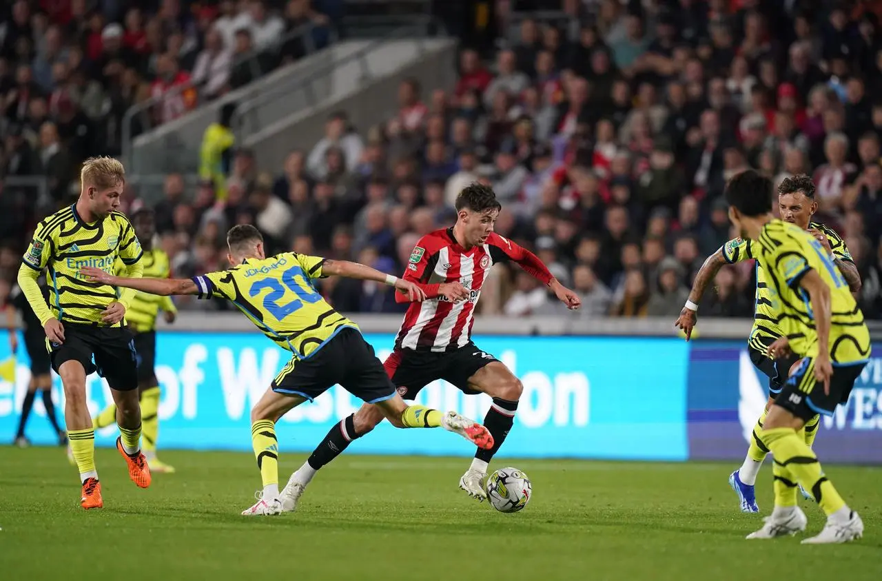 Brentford’s Aaron Hickey breaks past Arsenal's Jorginho