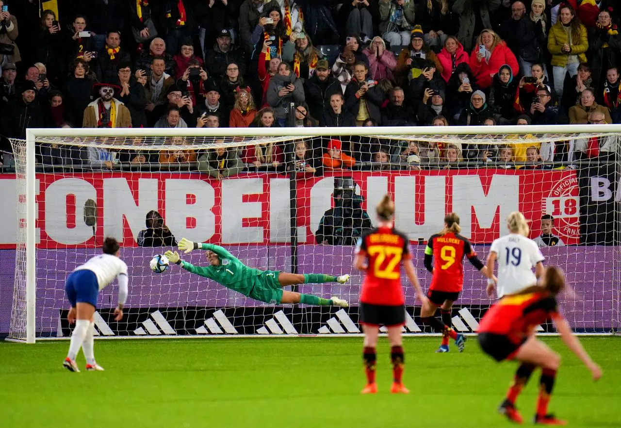 Tessa Wullaert, centre right, scores Belgium's winner from the penalty spot