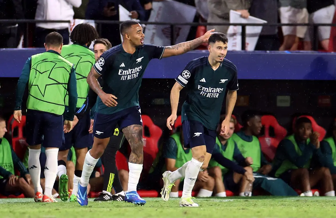 Gabriel Jesus, left, congratulates Gabriel Martinelli on his goal against Sevilla