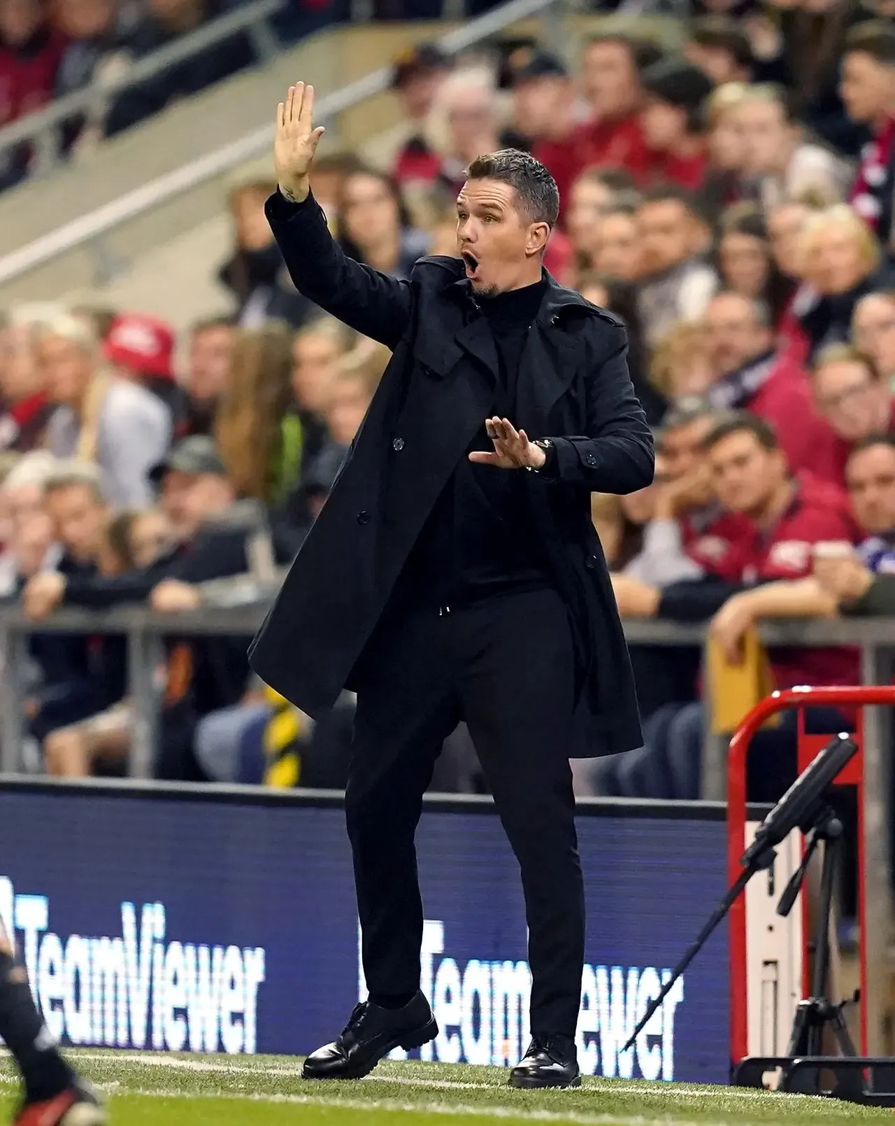 Marc Skinner shouts instructions to Manchester United in their game against Paris St Germain