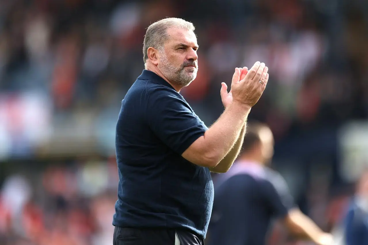 Tottenham manager Ange Postecoglou applauds the fans after the final whistle 