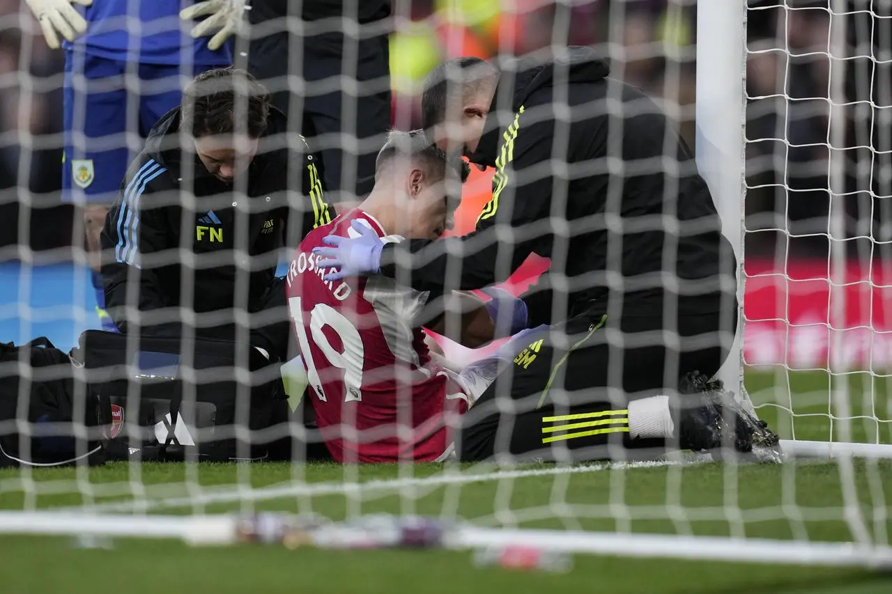 Trossard required medical attention after colliding with the post when scoring for Arsenal