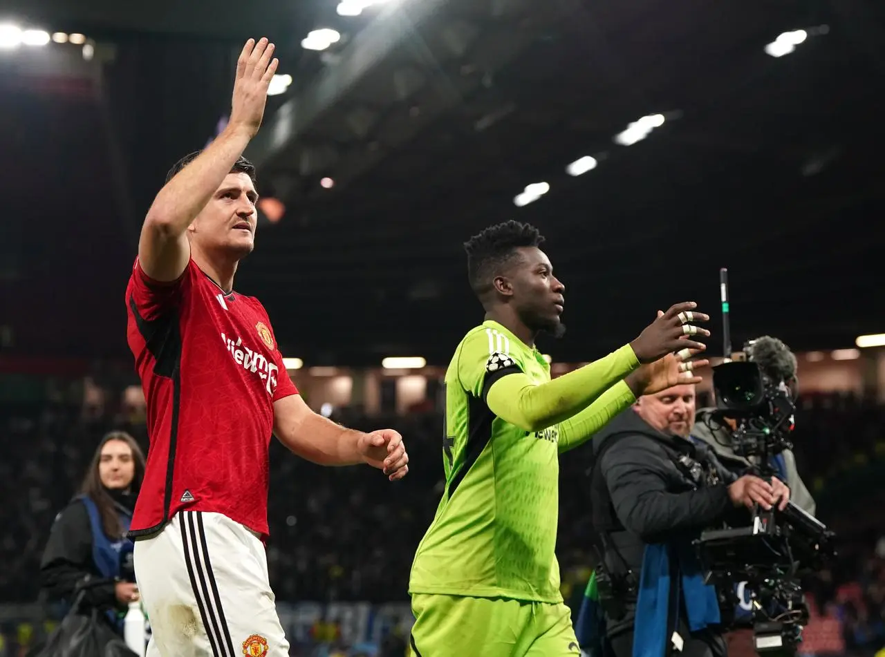 Harry Maguire, left, and Andre Onana celebrate victory over Copenhagen