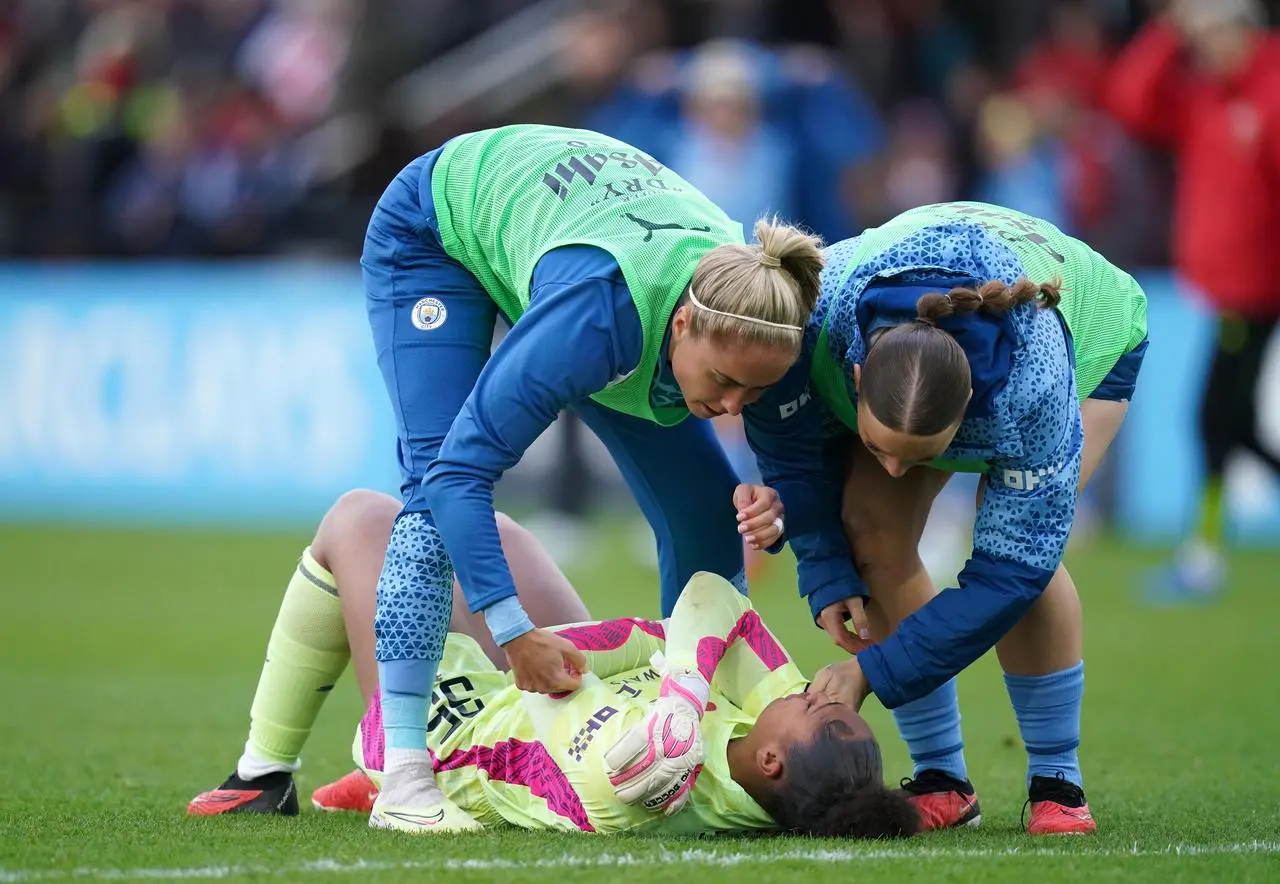 Keating is consoled by team-mates after City's 2-1 loss at Arsenal this month (John Walton/PA)