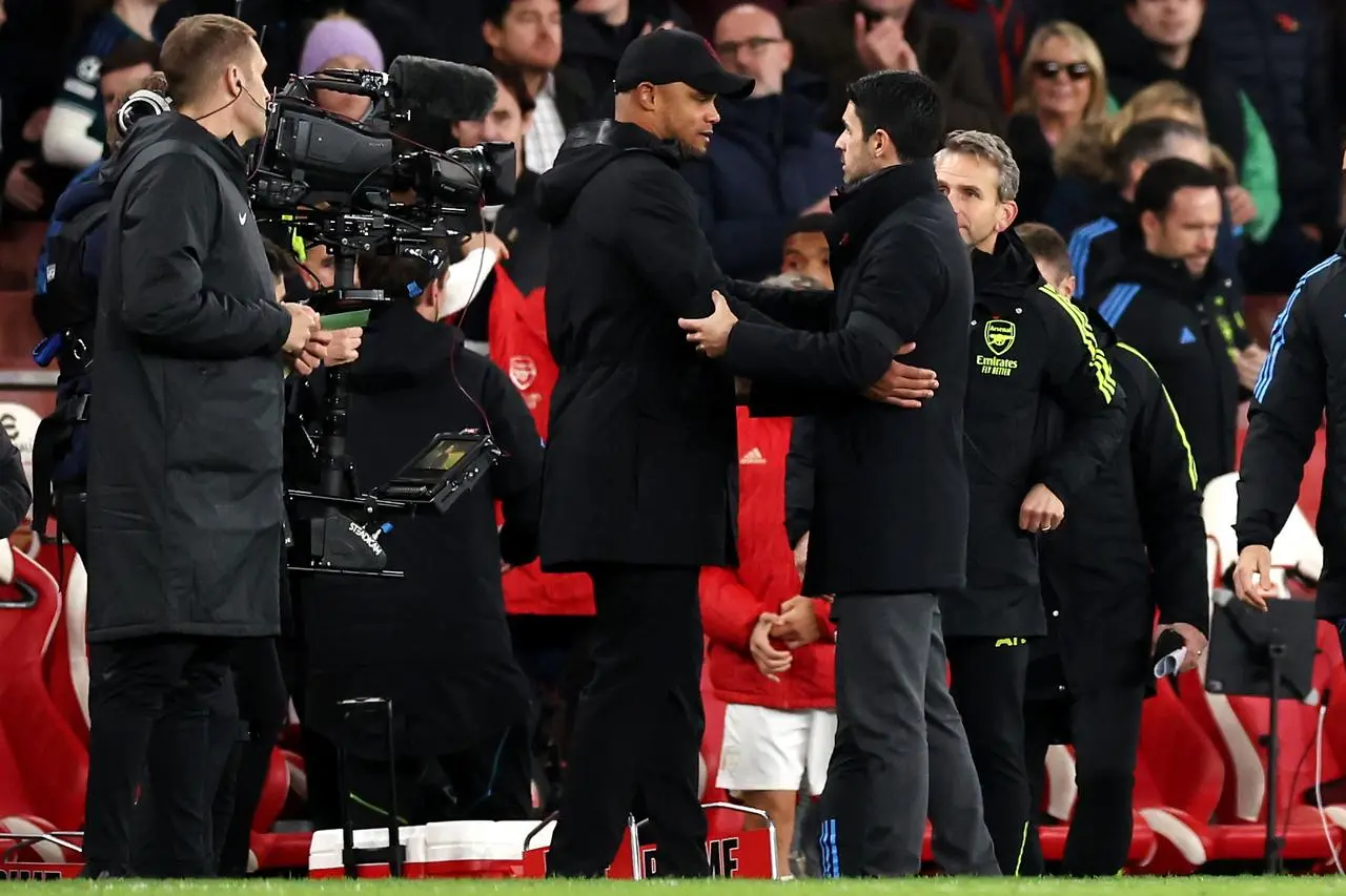 Mikel Arteta and Vincent Kompany embrace