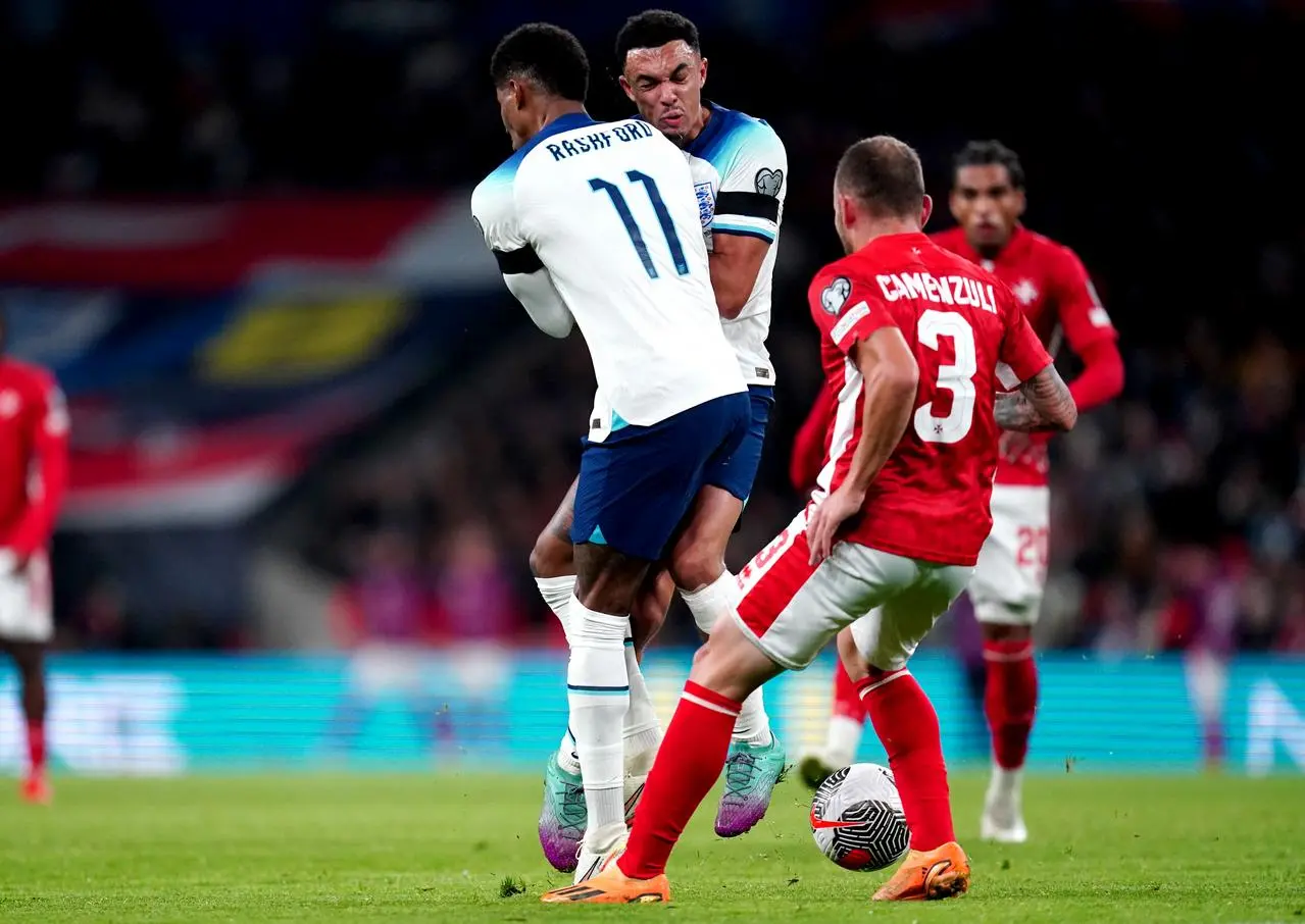 England’s Marcus Rashford and Trent Alexander-Arnold clash