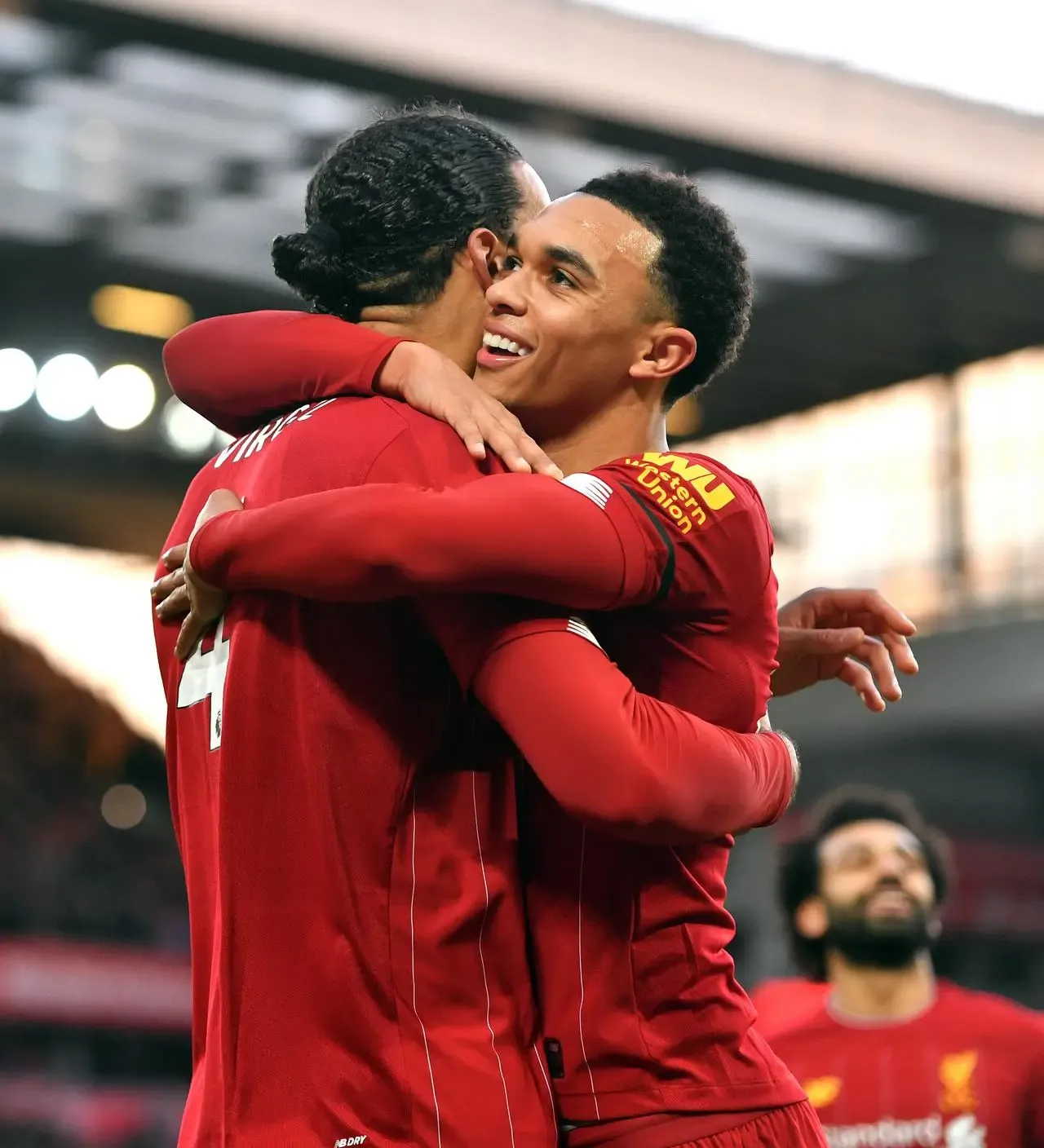 Liverpool’s Virgil van Dijk celebrates scoring with Trent Alexander-Arnold