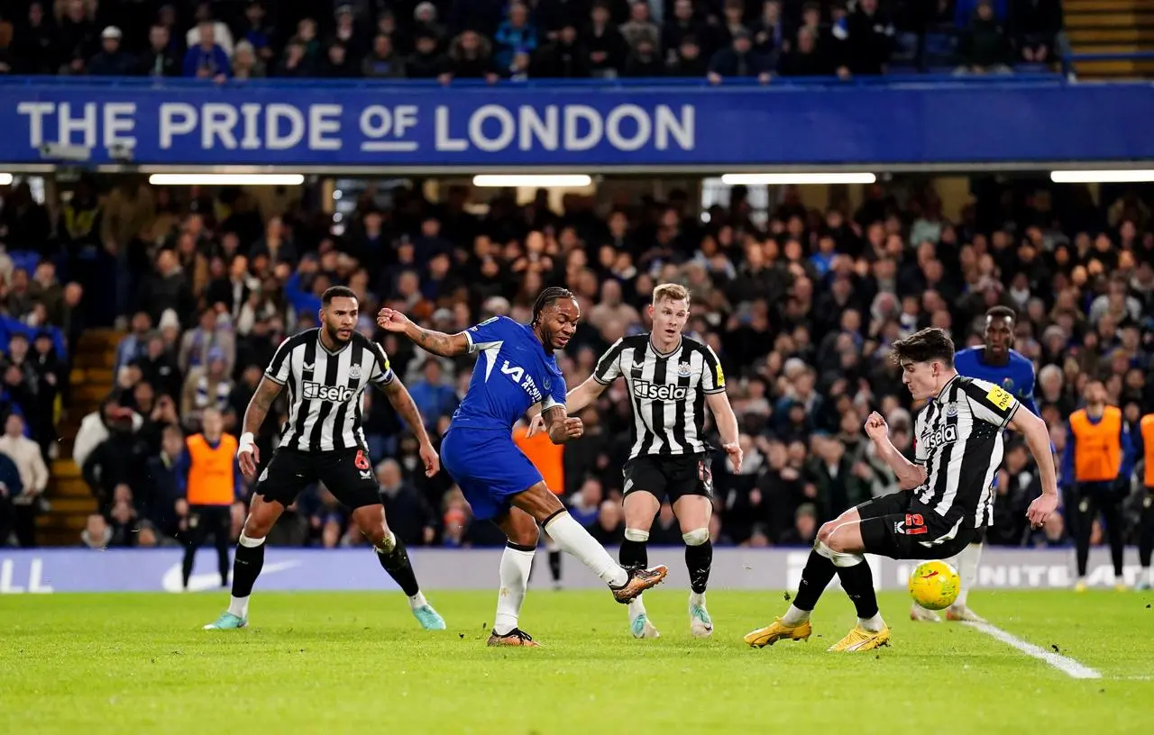 Chelsea's Raheem Sterling, centre, has an attempt on goal against Newcastle