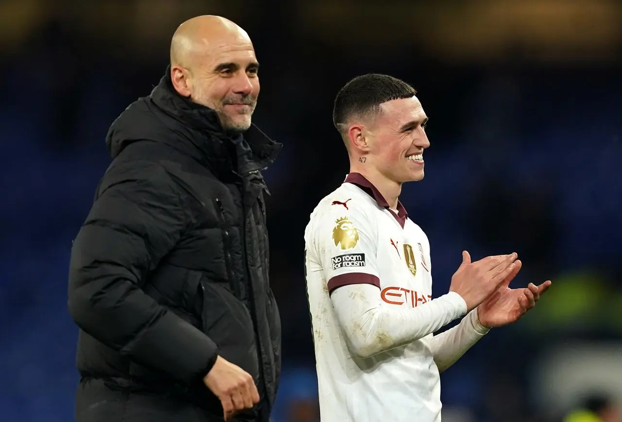 Pep Guardiola and Phil Foden