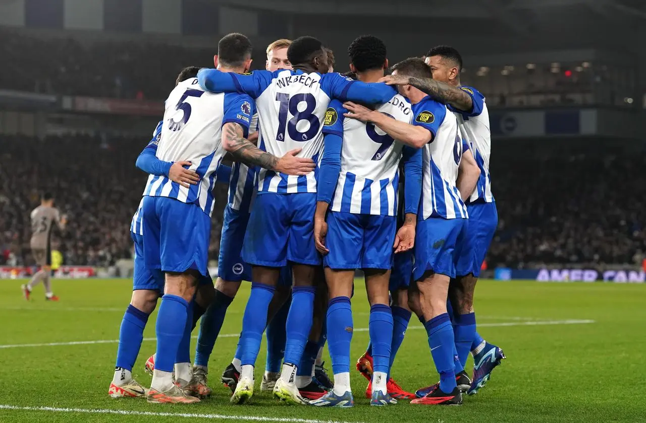 Brighton celebrate their second goal, scored by Joao Pedro