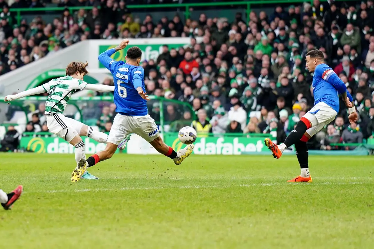 Kyogo Furuhashi, left, scores Celtic’s second goal