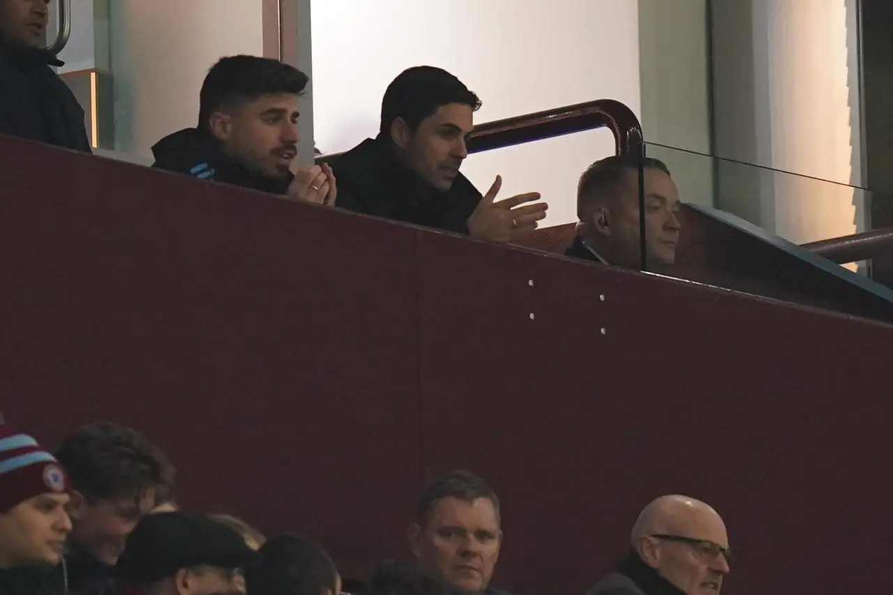 Arteta, centre, watched Arsenal’s defeat at Villa Park from the stands