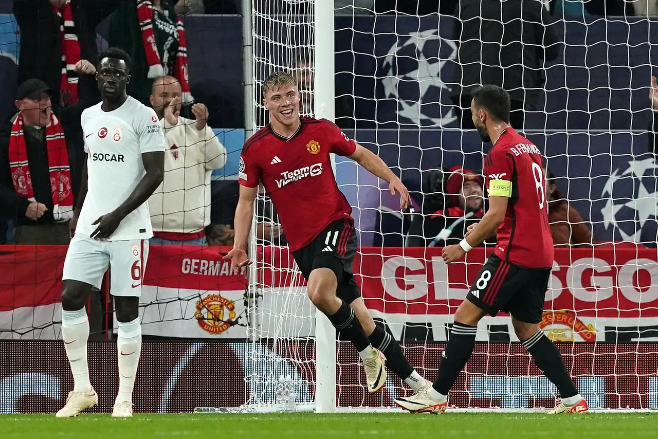 Rasmus Hojlund, centre, celebrates his first goal in the Champions League game against Galatasaray